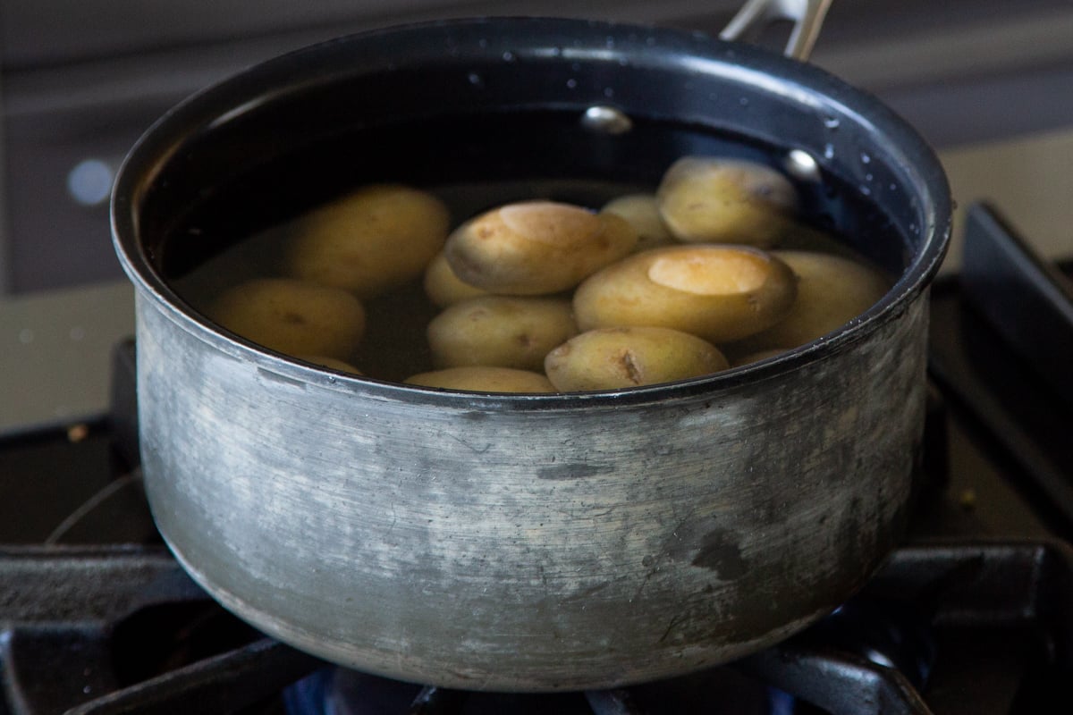 cooking potatoes in a pot on the stove