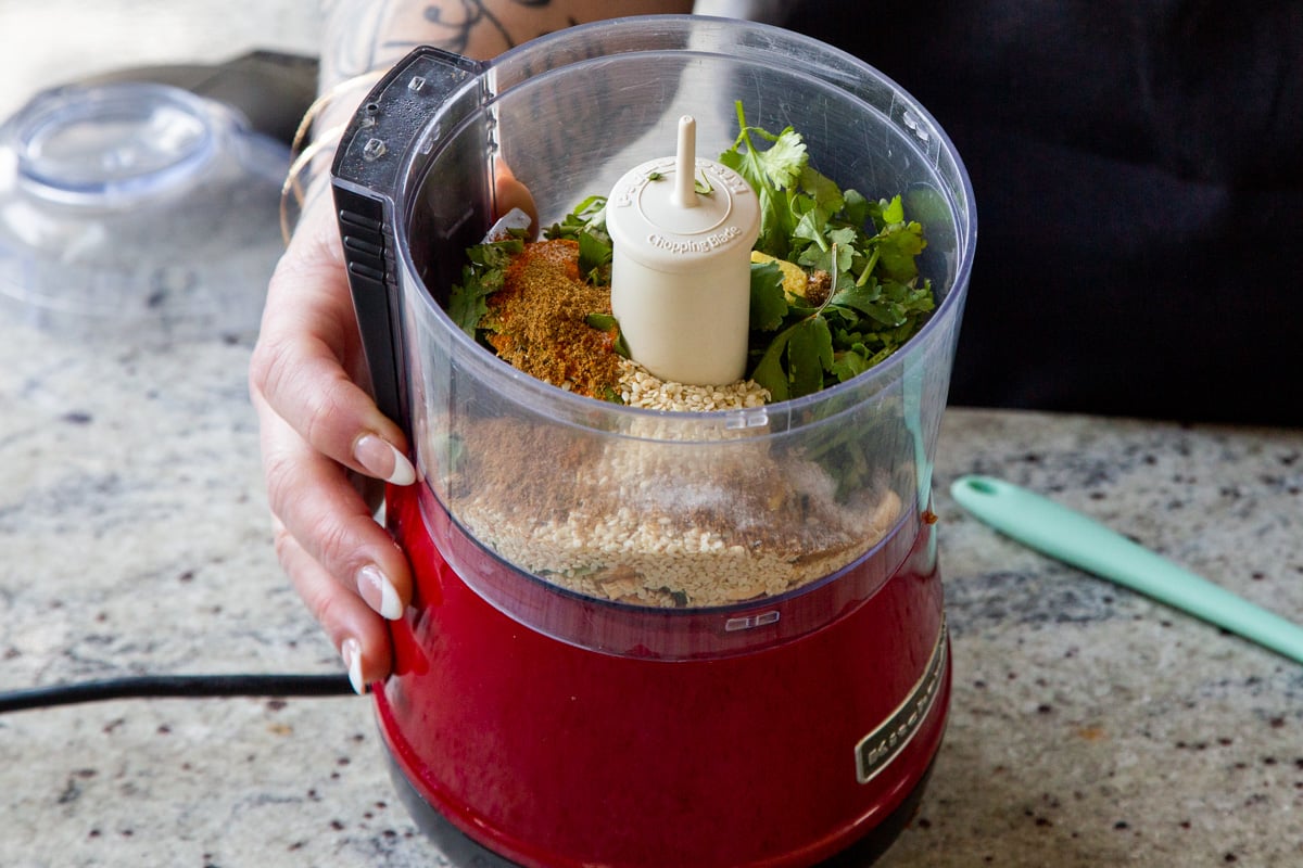 peanuts, sesame seeds, and spices in the food processor before grinding