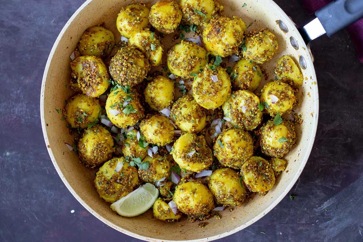 peanut sesame potatoes in the frying pan, with garnishes