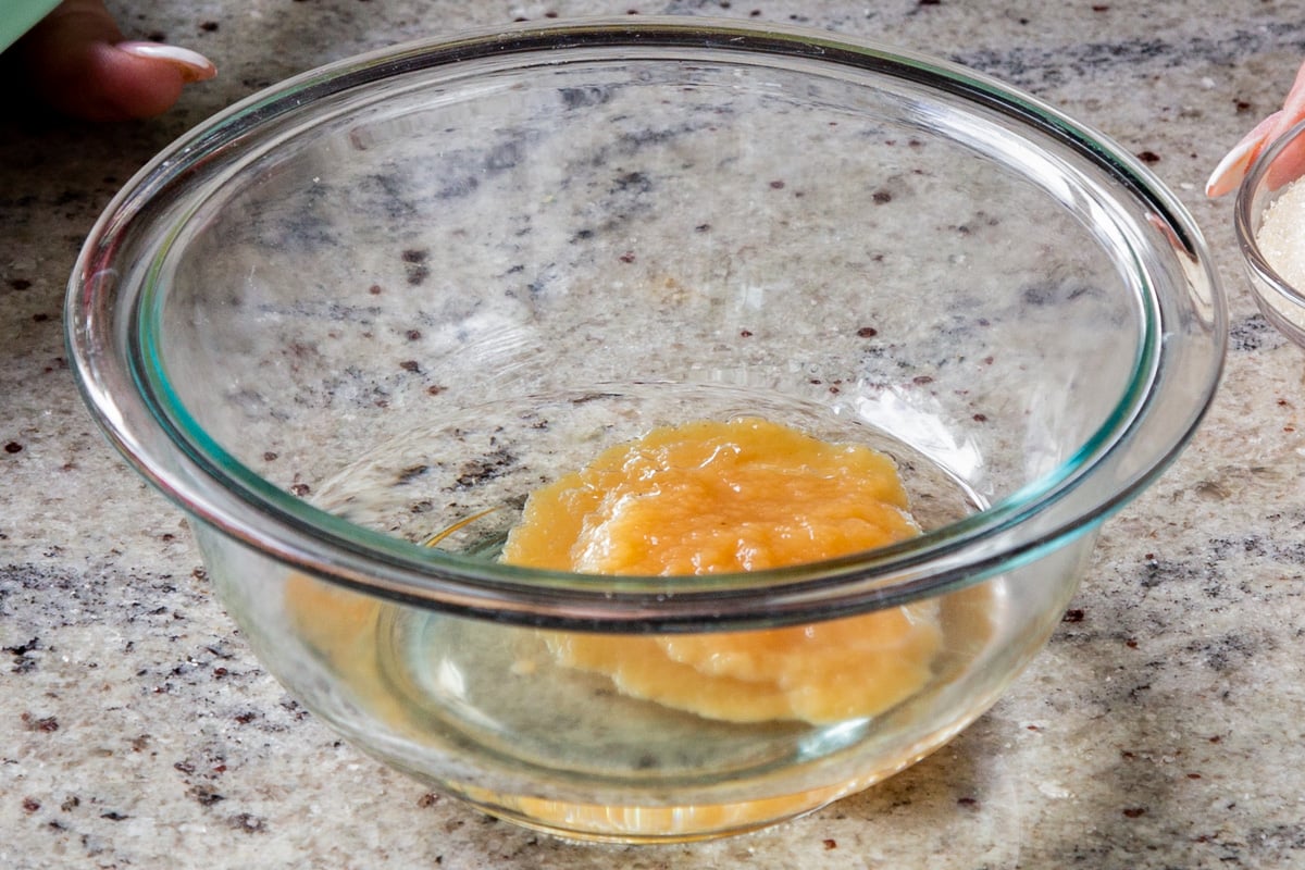 oil and applesauce in a mixing bowl