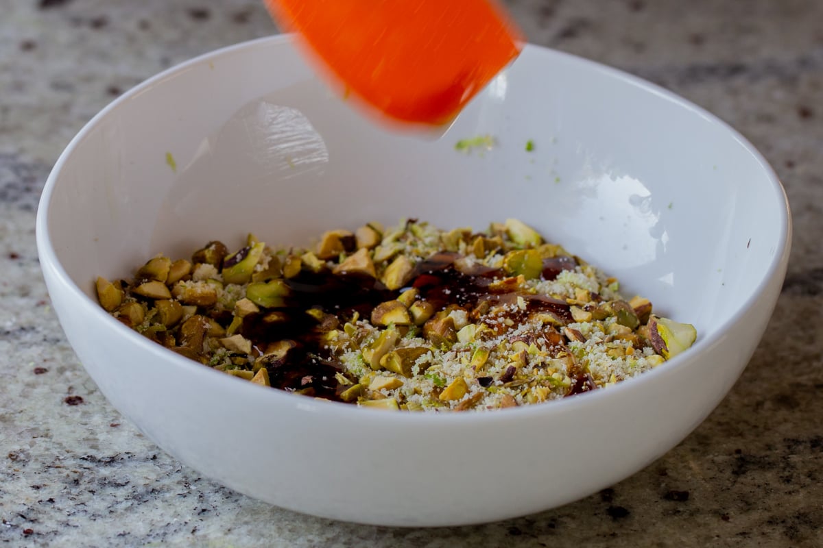 adding maple syrup to the nut mixture