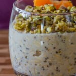 close-up of baklava overnight oats topped with nuts and oranges