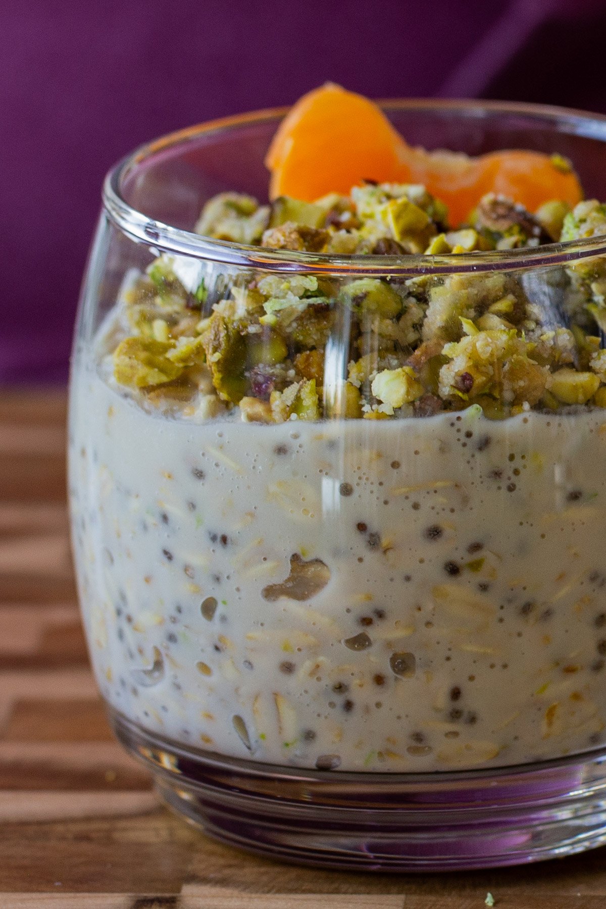 close-up of baklava overnight oats topped with nuts and oranges