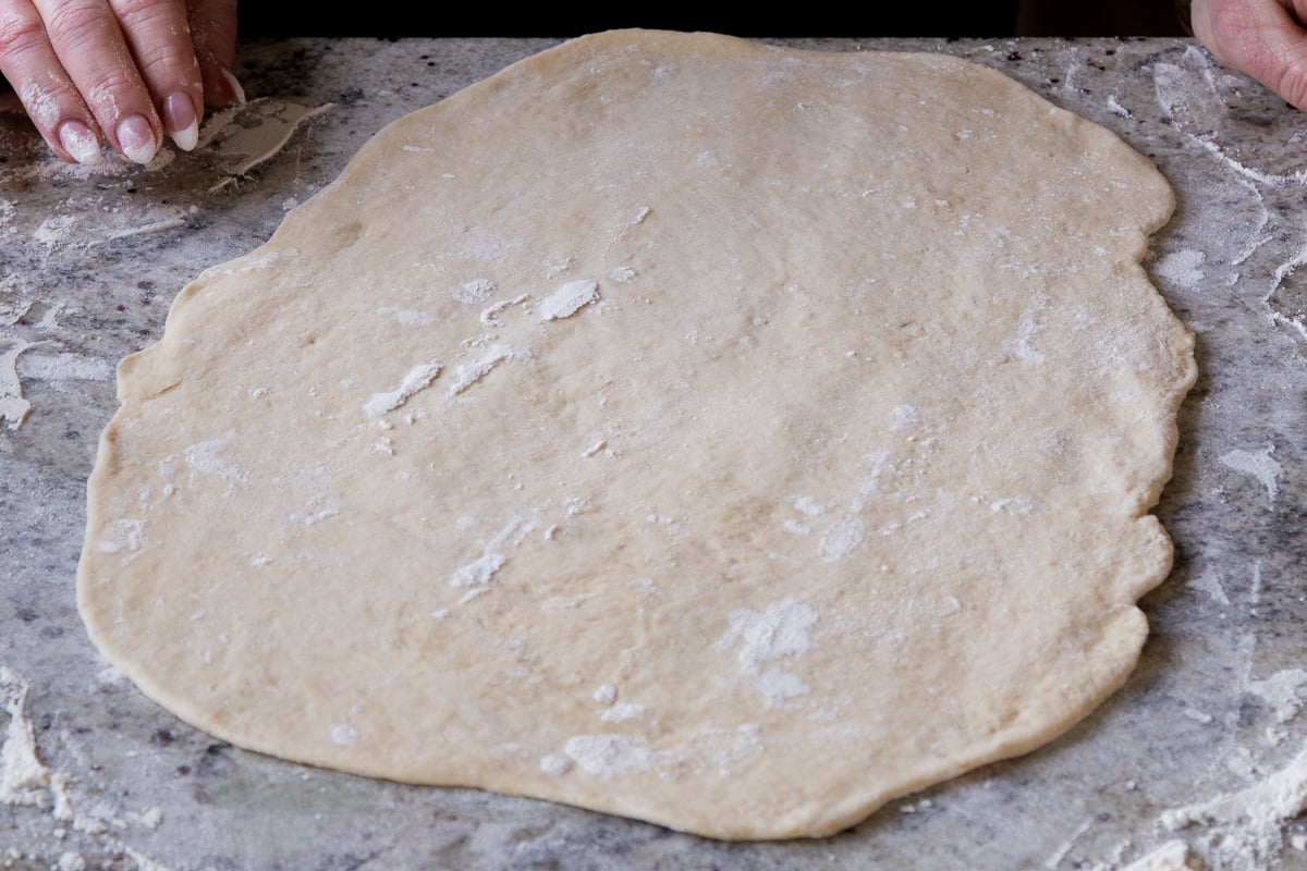 dough on a floured surface, after rolling it out