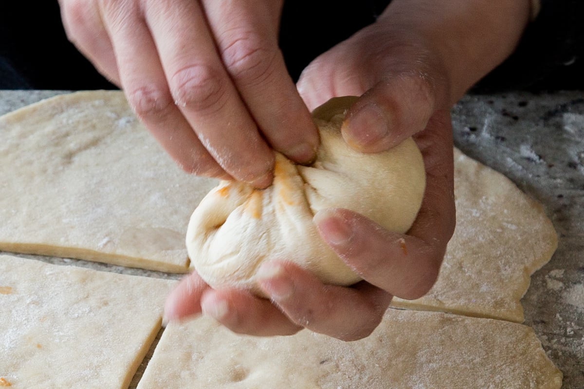 twisting the top of the bao, to give it that signature look