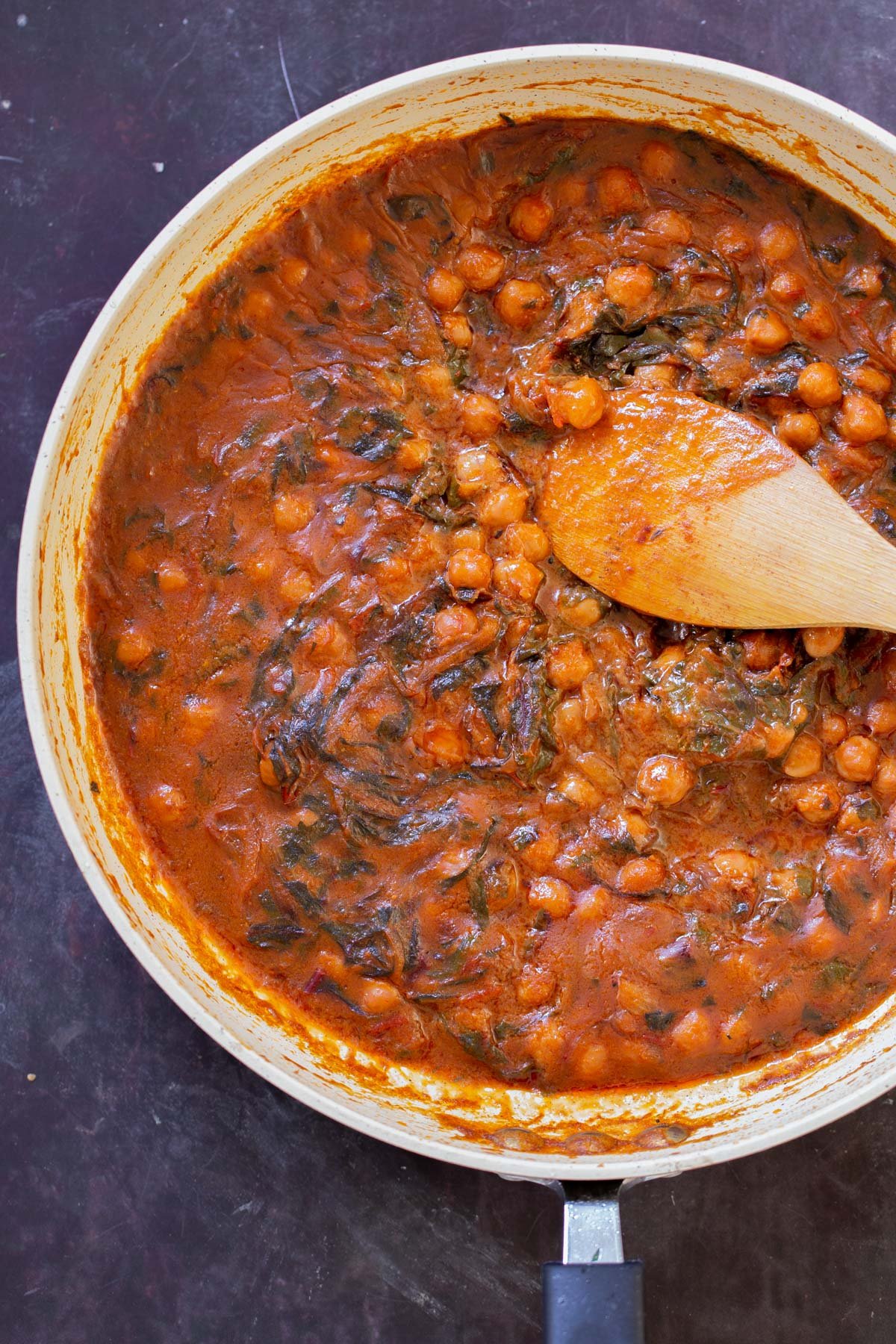 panful of harissa chickpeas after cooking but before stirring, so you can see the glaze on top