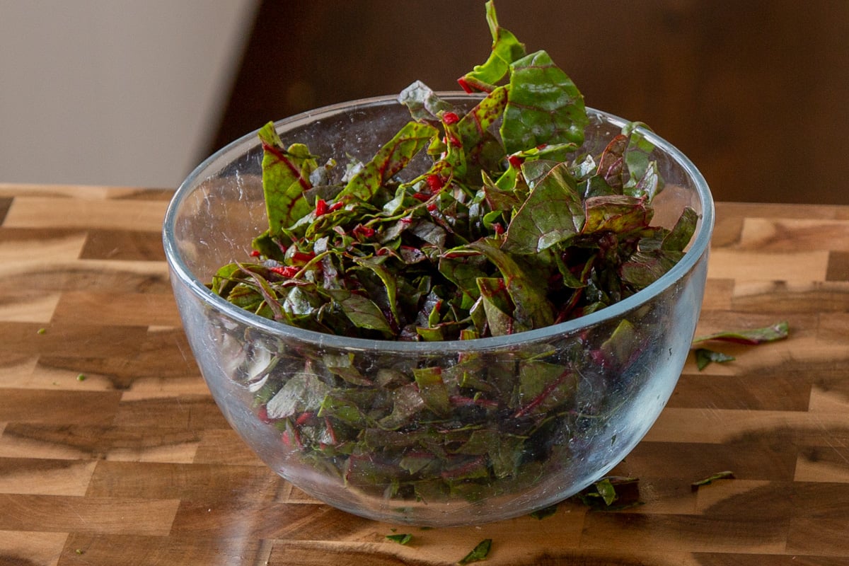 bite-sized pieces of Swiss chard in a glass bowl