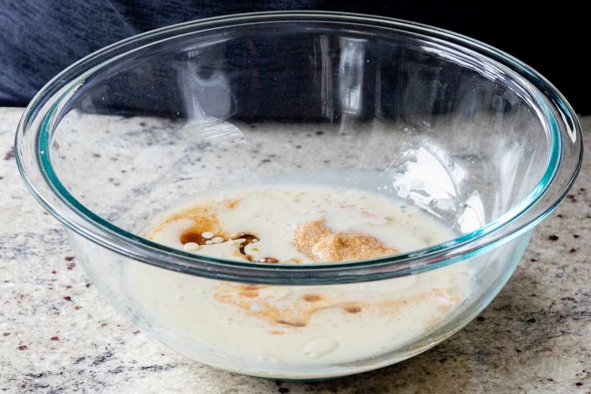 adding vanilla extract to the milk-sugar mixture