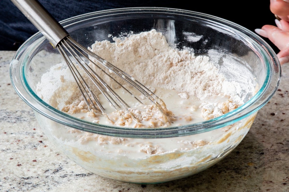 mixing half of the dry ingredients into the wet