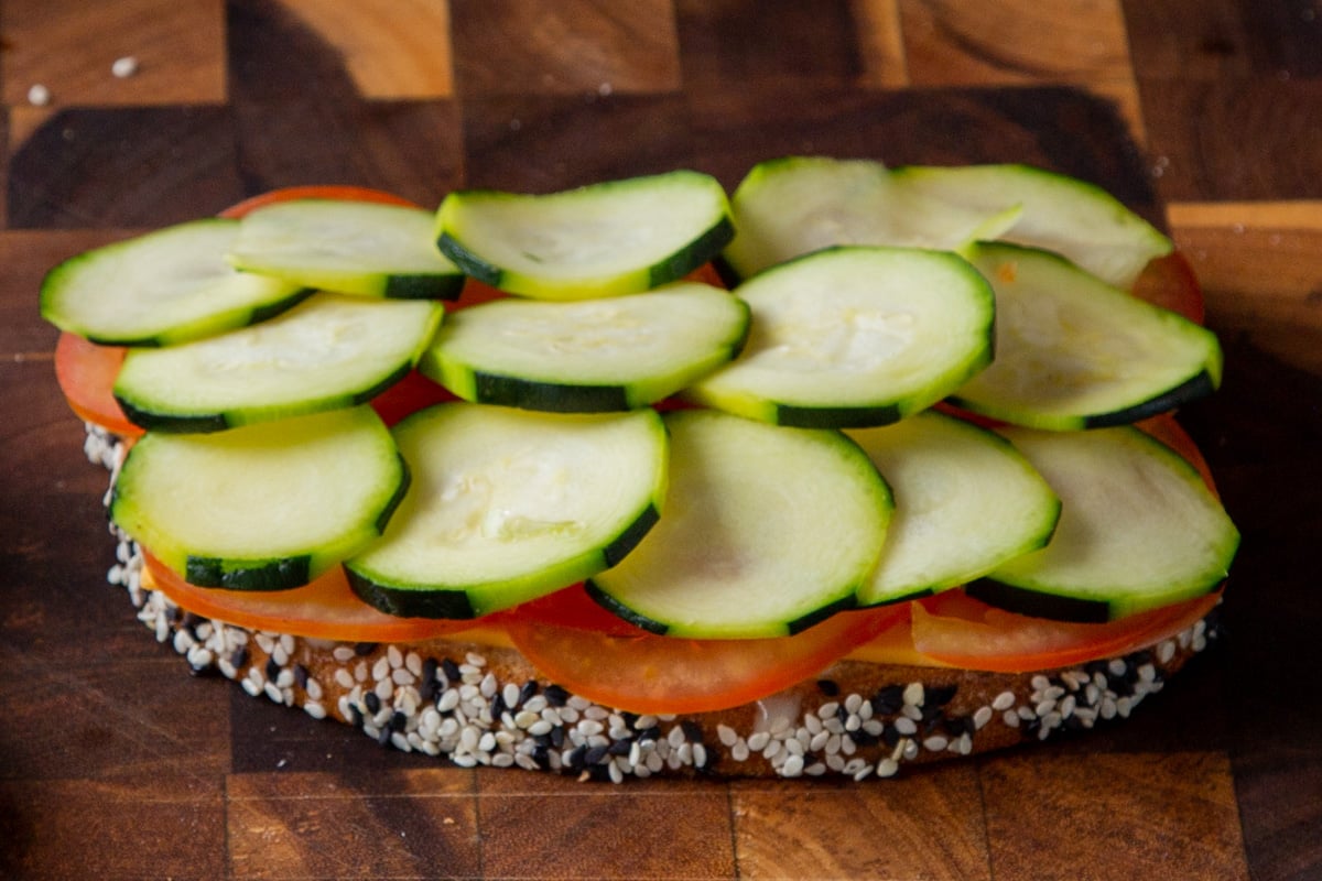 tomato and cucumber added to the bread slice