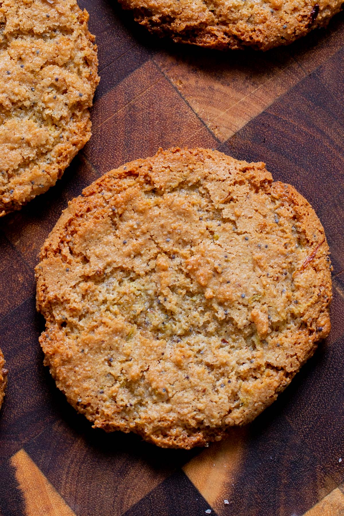 close-up of a vegan lemon cookie on a wooden table