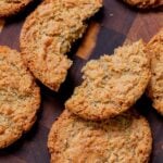 vegan lemon cookie broken in half on a wooden table
