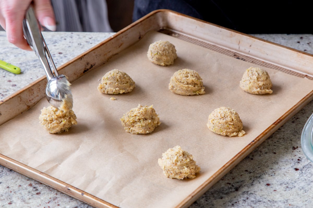 scooping dough onto the cookie sheet