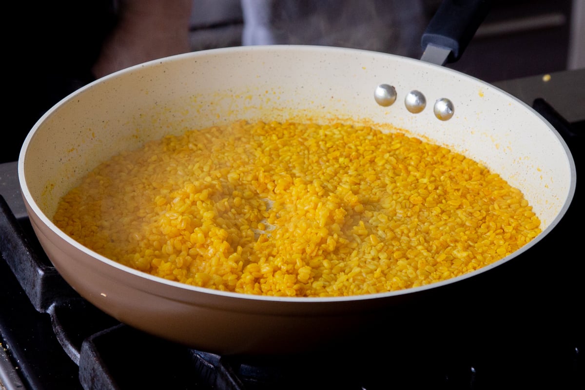 cooked moong dal in the frying pan