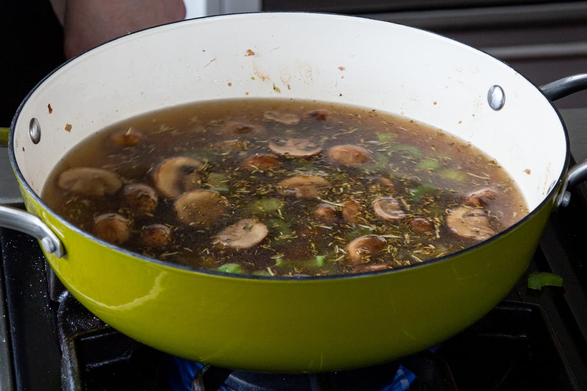 mushroom mixture in the pan, after adding the broth