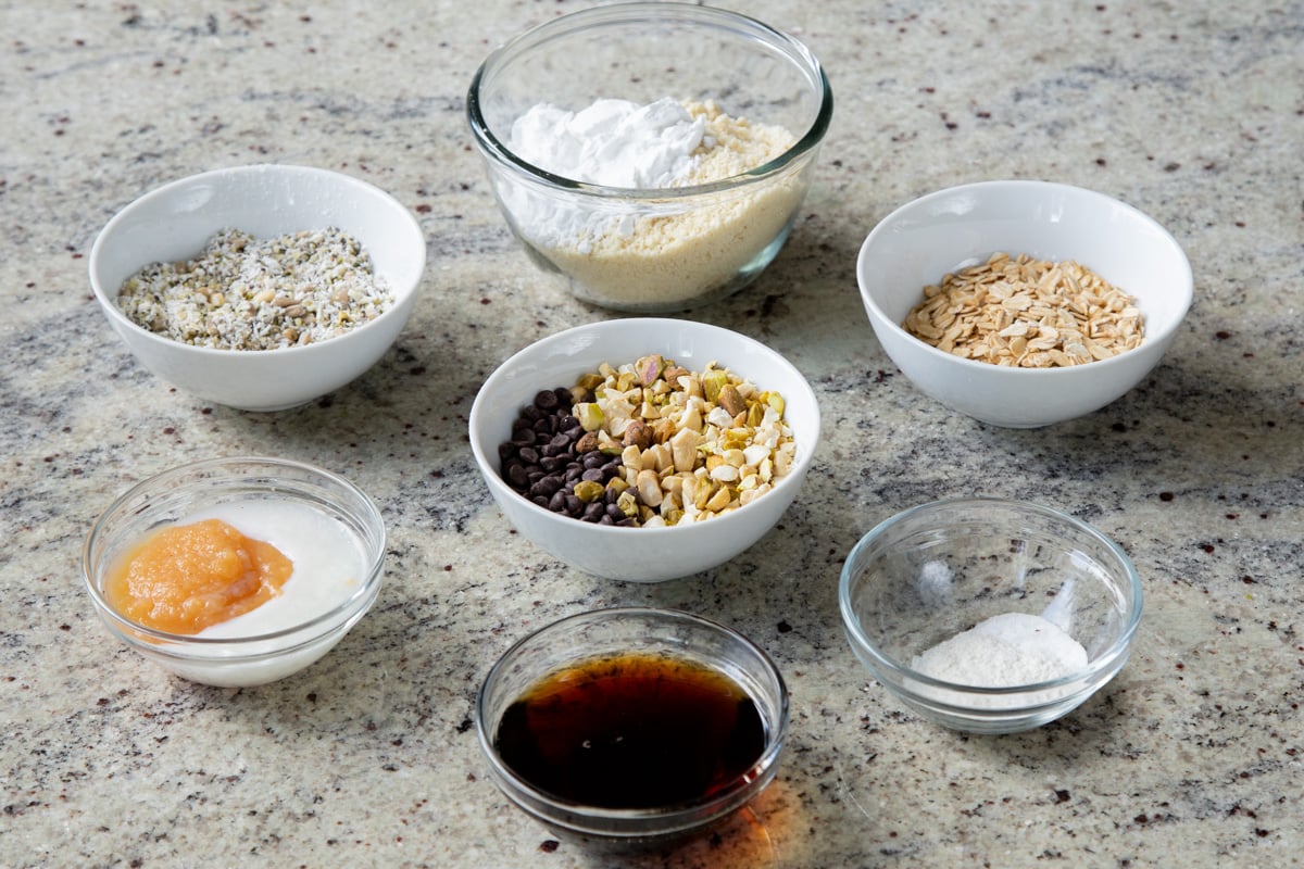 almond flour, nuts, seeds, chocolate, and other baking ingredients on a kitchen counter