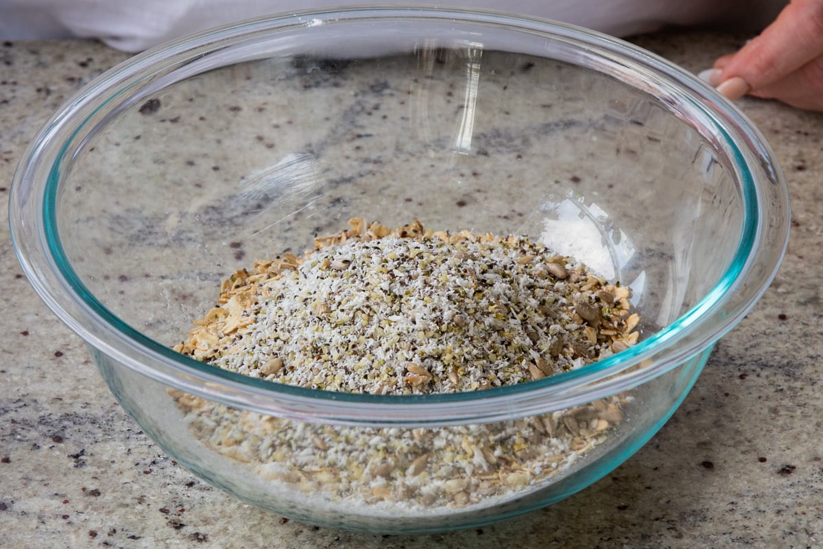 adding seeds to the mixing bowl