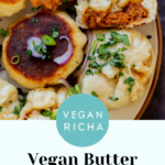 serving plate of butter chicken bao with one flipped so you can see the crispy bottom and one town in half so you can see the filling, text overlay