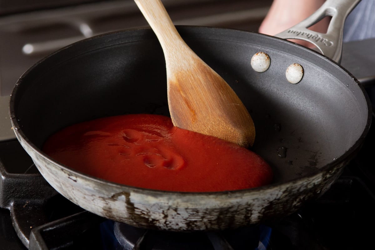 tomato puree in the skillet