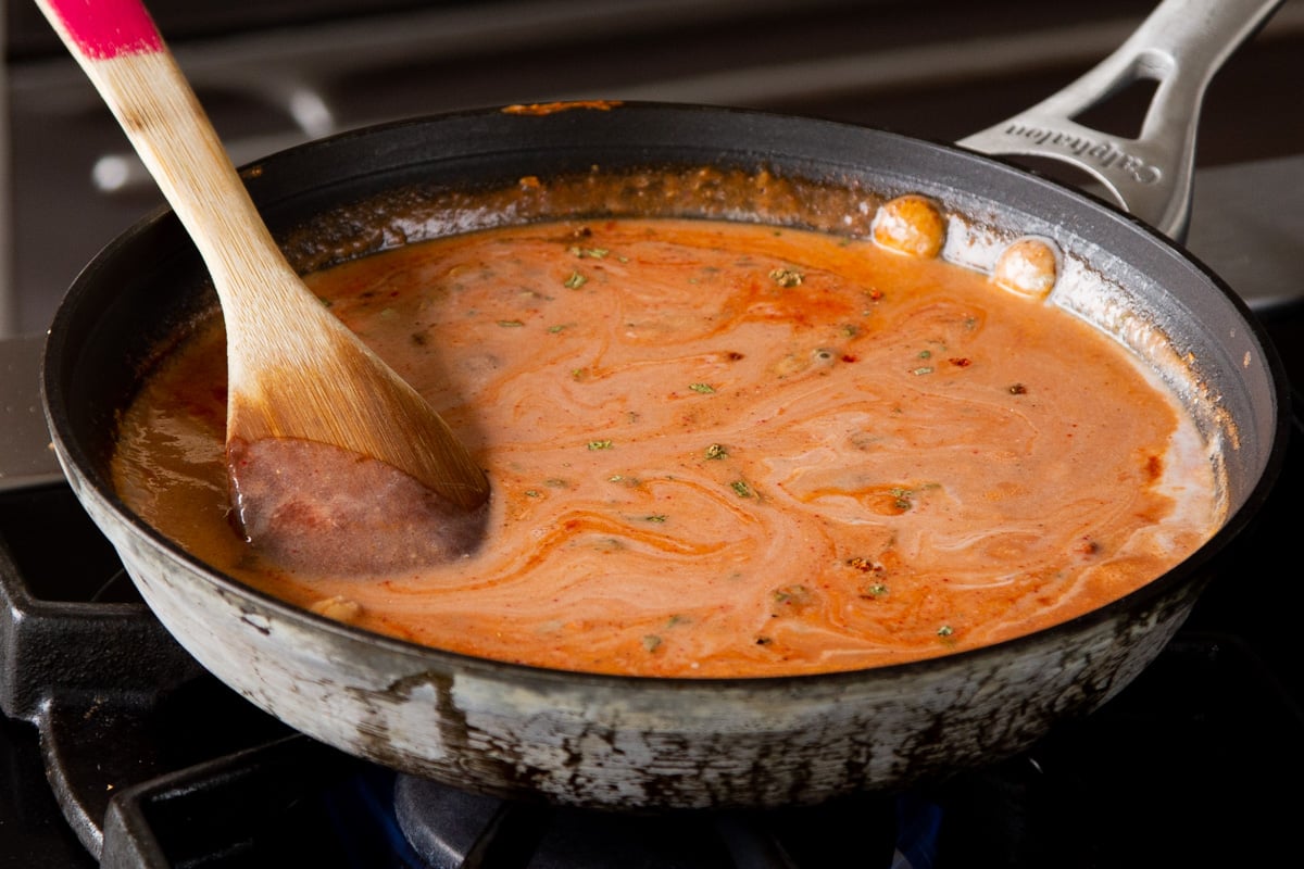 sauce ingredients and chickpeas all mixed together before simmering