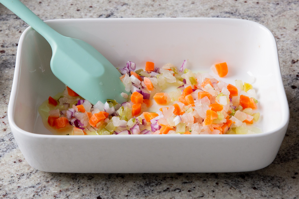 onions, carrots, and garlic in the pan, after baking