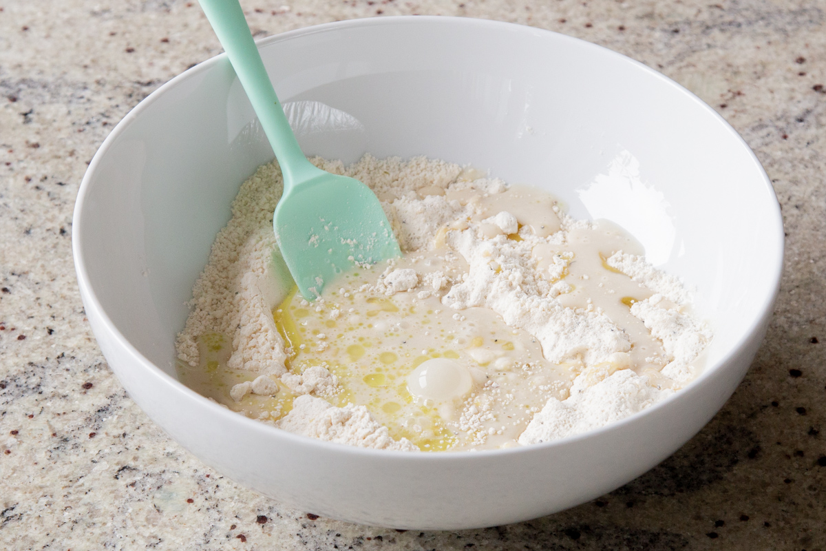 adding wet ingredients to the dry