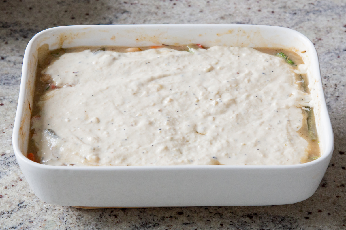 biscuit dough spread on top of the pan
