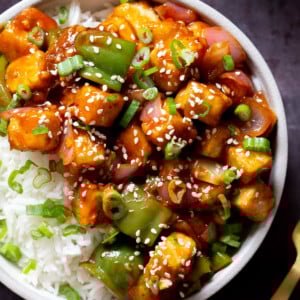 close-up of a bowl of honey chilli tofu over rice