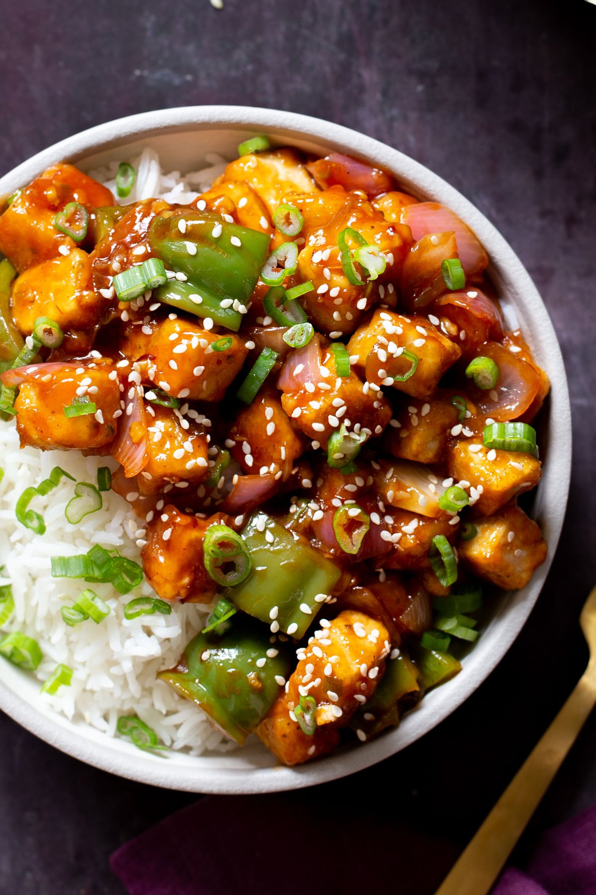 close-up of a bowl of honey chilli tofu over rice