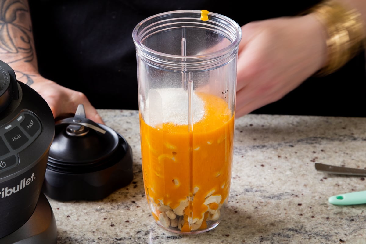 cashews, mango puree, and sugar in the blender canister, before blending