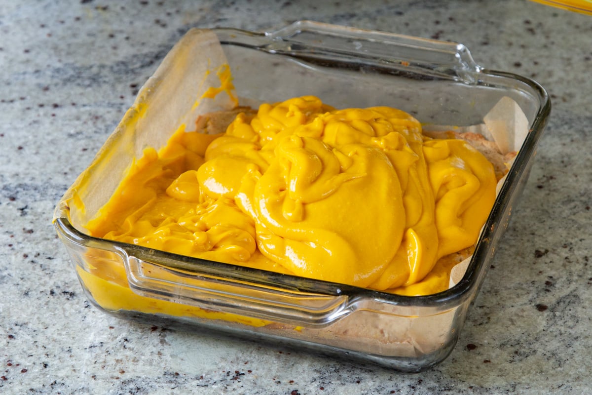 blended mango custard layered onto the crust, before spreading out
