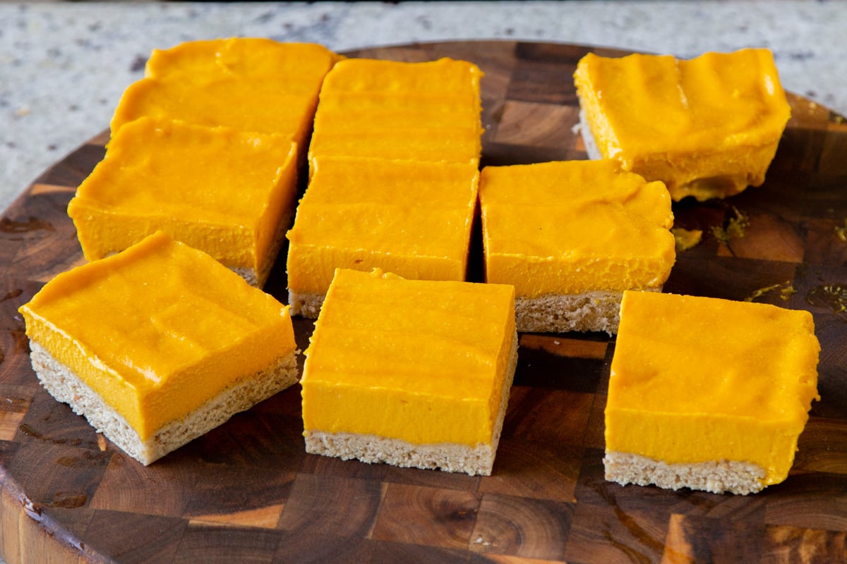 mango squares, all sliced up on a cutting board