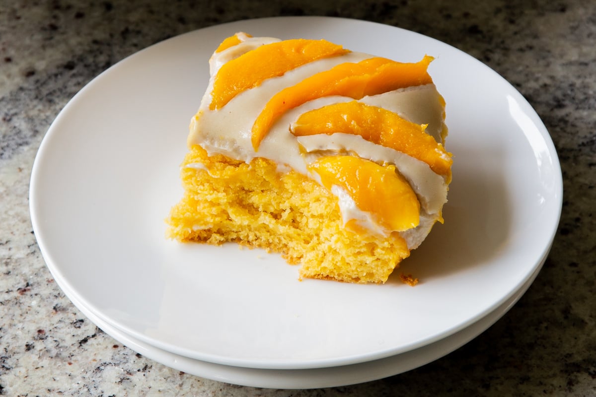 slice of mango tiramisu with a bite taken out