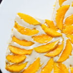 overhead phot of mango tiramisu with a slice cut out