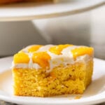 slice of mango tiramisu with a bite taken out, so you can see the inside texture
