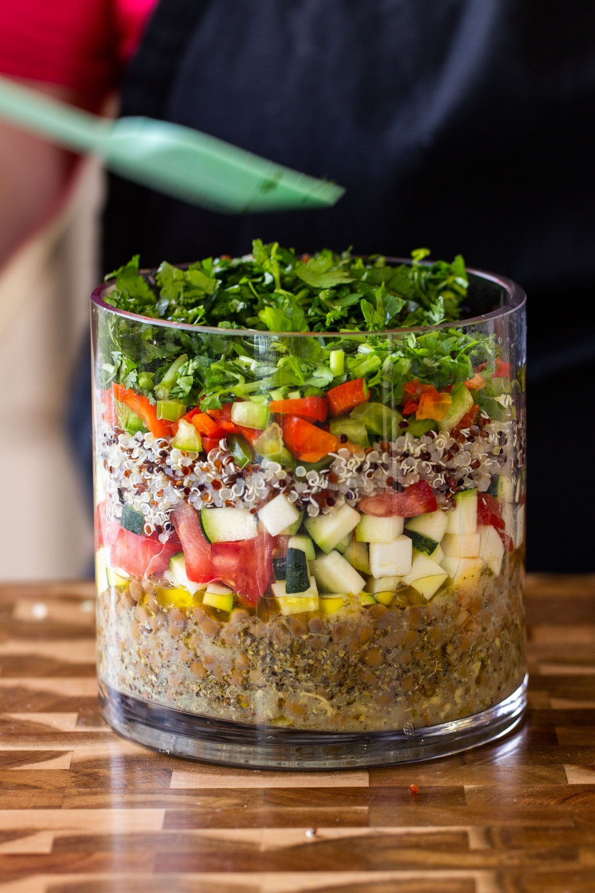adding cilantro layer to the salad