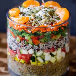 adding orange and seeds layer to the salad
