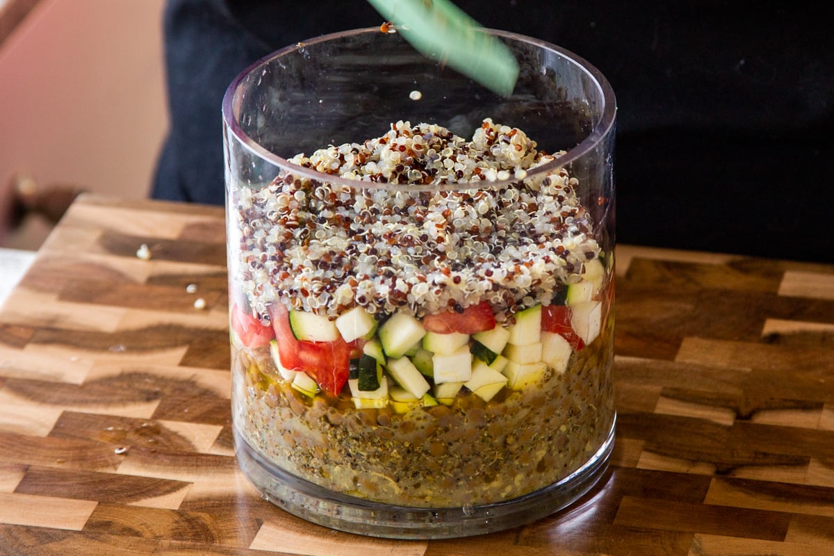 adding quinoa layer to the salad
