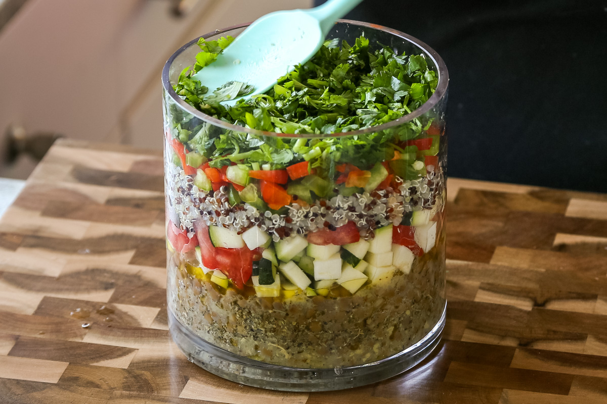 adding cilantro layer to the salad