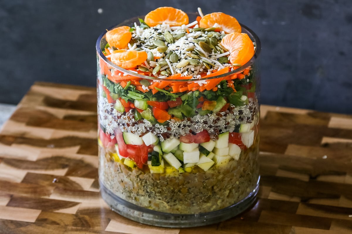 layered lentil quinoa salad in a large glass jar