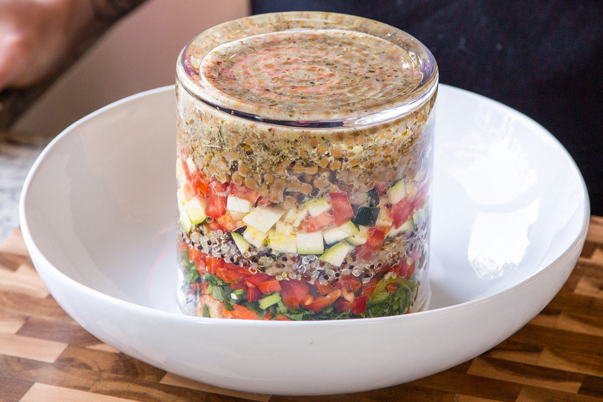 inverting the jar salad into a mixing bowl