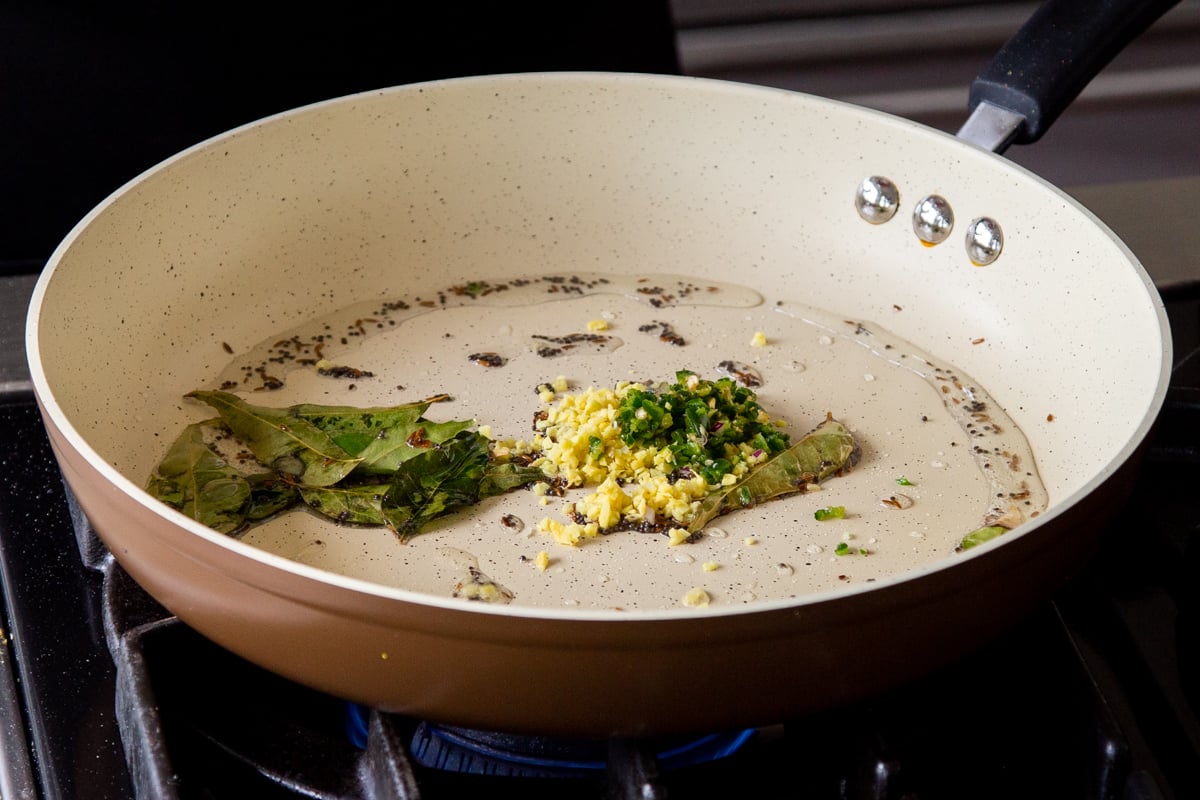 adding ginger and chili to the pan