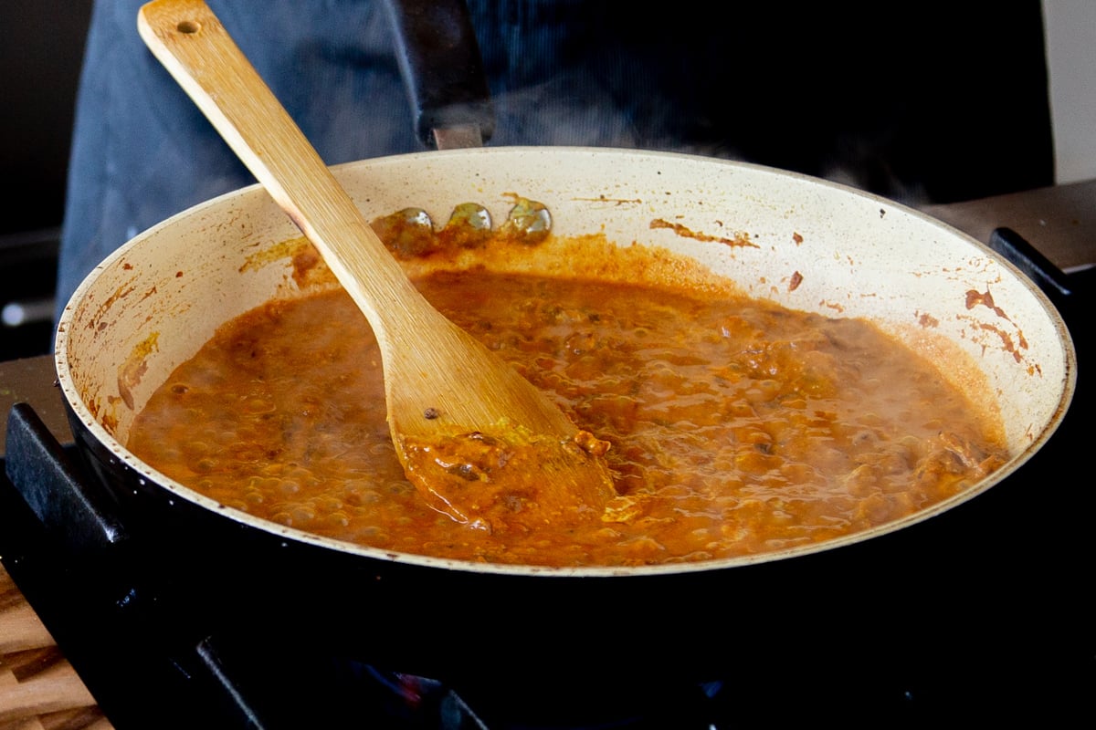 simmering sauce after adding the water