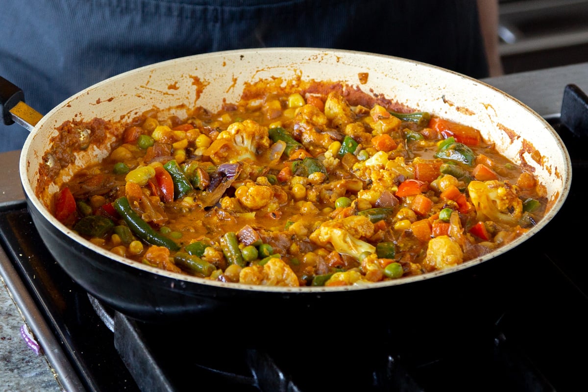 vegetable bhuna in the pan, after mixing in the topping