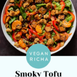 vegan summer salad in a bowl with tofu, croutons, veggies and oranges, text overlay