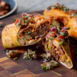 close-up of crispy tofu burrito cut in half so you can see the filling