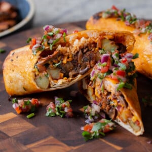 close-up of crispy tofu burrito cut in half so you can see the filling