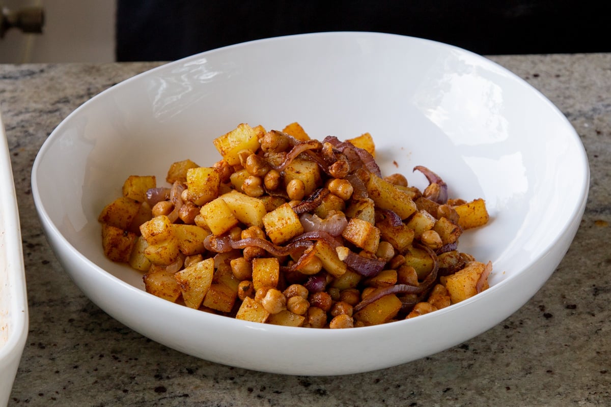 chickpeas, onions, and potatoes in the salad bowl after roasting