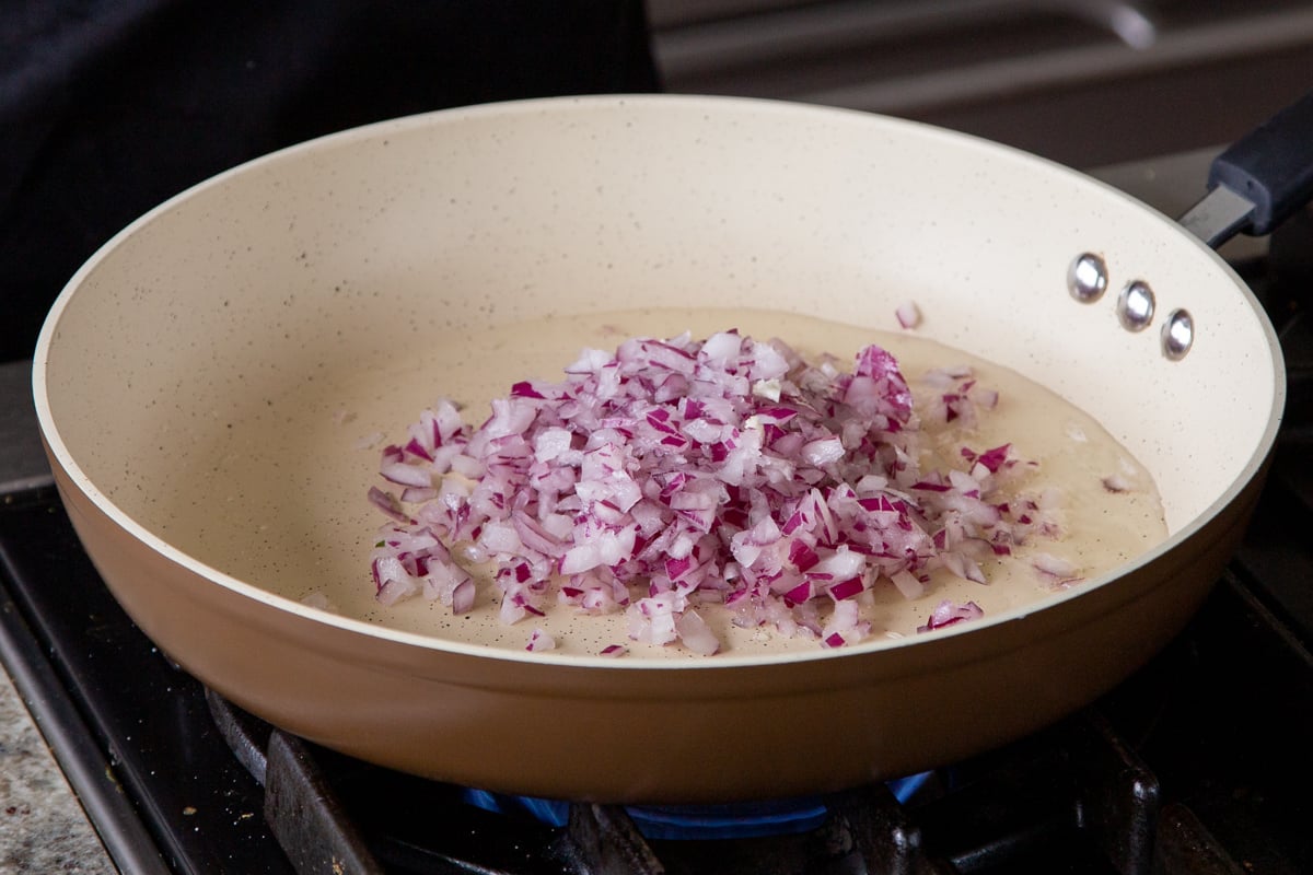 adding onion to the pan