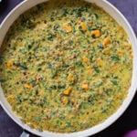 panful of lentil coconut curry on a slate table
